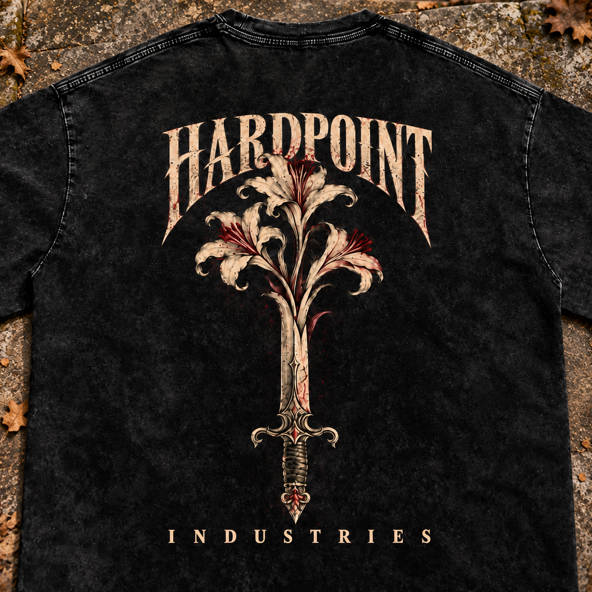 HARDPOINT Floral Blade Snow-Washed Oversized Tee, Black, detail view on aged stone steps. AI-styled product mockup.