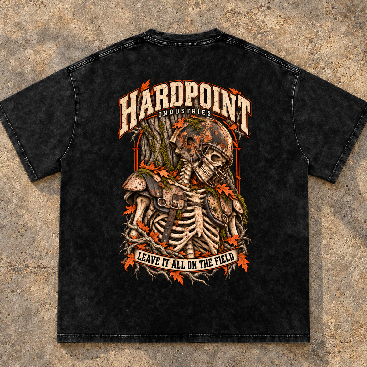 HARDPOINT Leave It All on the Field Snow-Washed Oversized Tee, Black, detail view on sports-field concrete landing. AI-styled product mockup.
