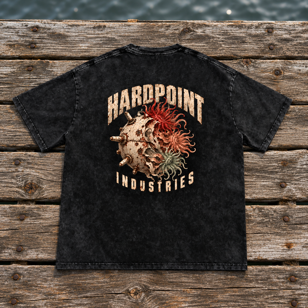 HARDPOINT Tentacle Shell tee, Black, back view on a weathered dock. AI-styled product mockup.