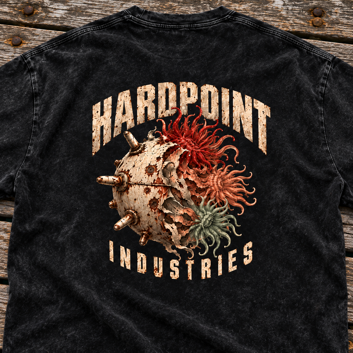 HARDPOINT Tentacle Shell tee, Black, detail view on a weathered dock. AI-styled product mockup.